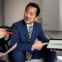 business-man-working-with-ipad-side-view